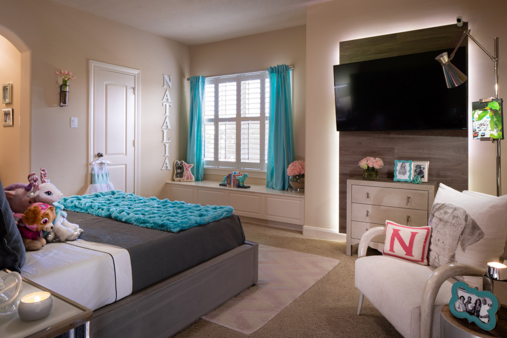 Photo of a mid-sized modern kids' bedroom for kids 4-10 years old and girls in Houston with beige walls, carpet and beige floor.