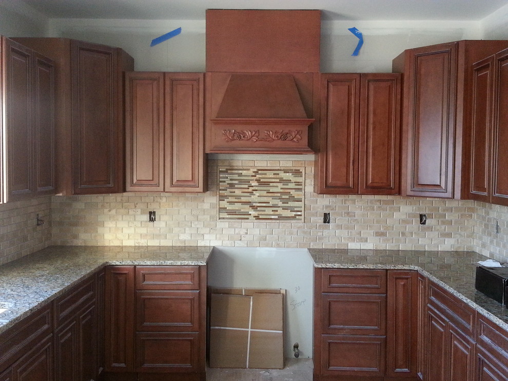 Inspiration for a mid-sized l-shaped light wood floor eat-in kitchen remodel in Newark with a drop-in sink, raised-panel cabinets, white cabinets, granite countertops, white backsplash, subway tile backsplash, stainless steel appliances and an island