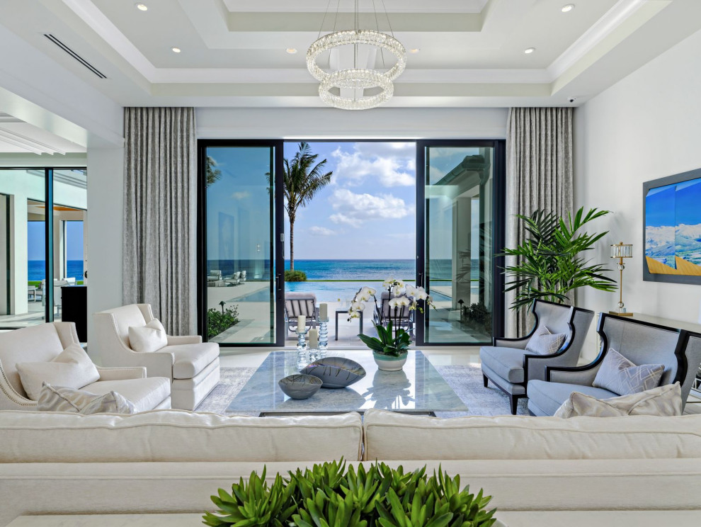 Expansive traditional living room in Miami with white walls and a wall mounted tv.
