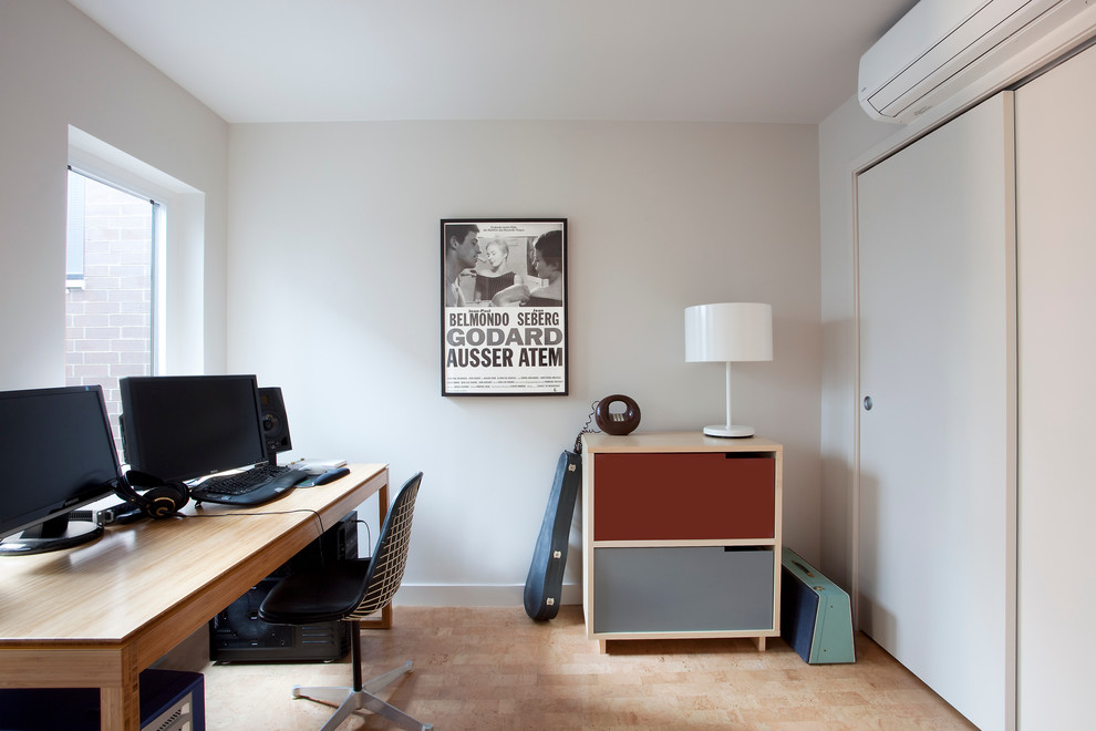 This is an example of a modern home office in Chicago with grey walls.