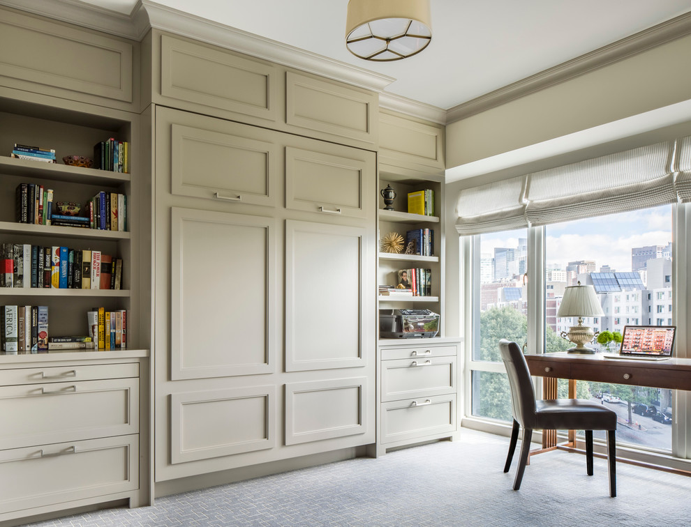 Photo of a transitional study room in Boston with beige walls, carpet and a freestanding desk.