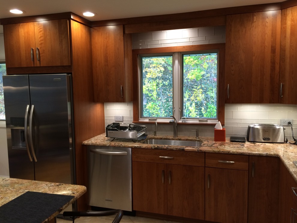 Example of a transitional kitchen design in New York