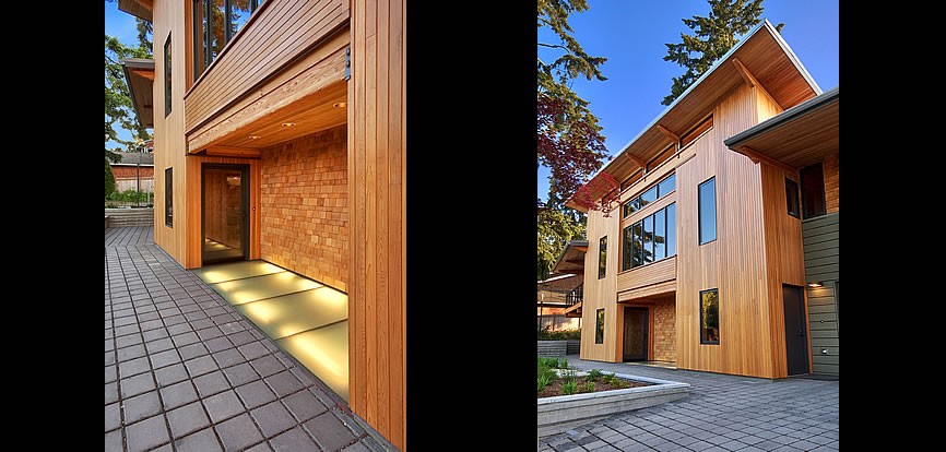 Inspiration for a large modern two-storey brown exterior in Seattle with wood siding and a flat roof.