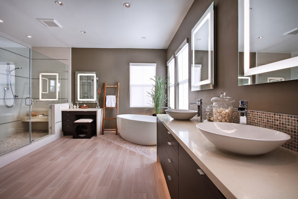 Contemporary bathroom in Orange County with pebble tile floors.