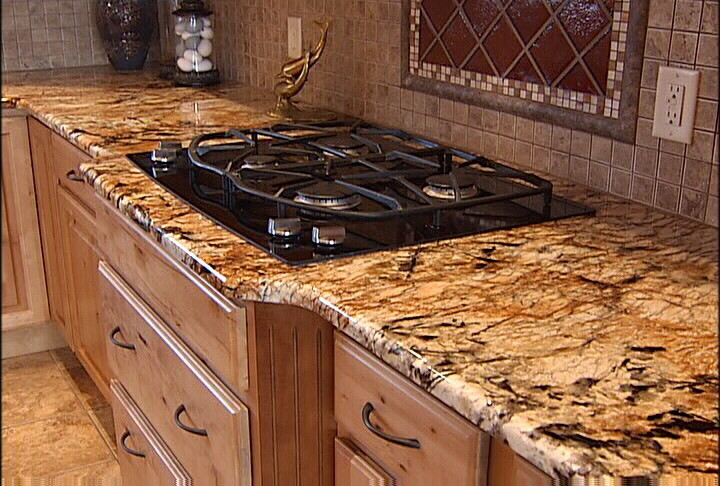 Mountain style kitchen photo with limestone countertops