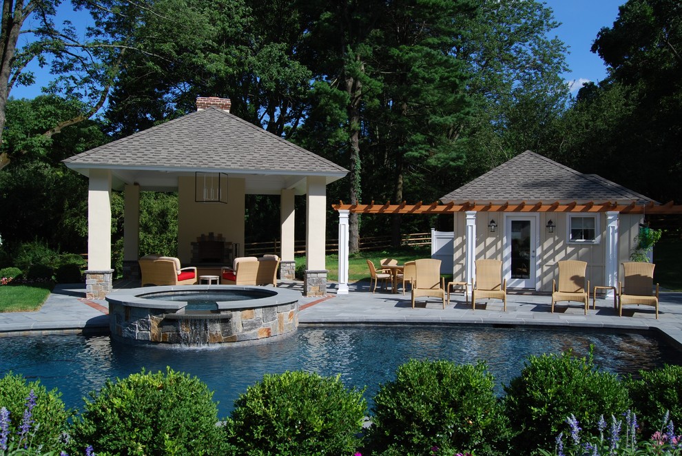 Large contemporary backyard patio in Philadelphia with an outdoor kitchen, natural stone pavers and a gazebo/cabana.