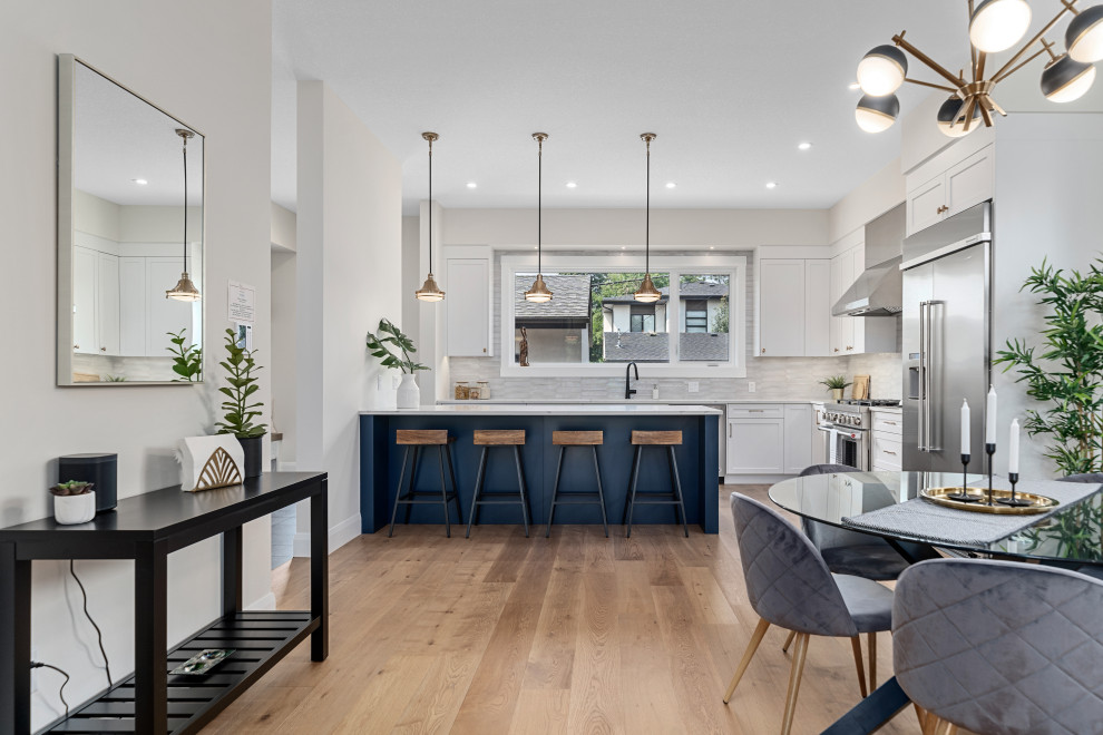 Example of a transitional home design design in Calgary