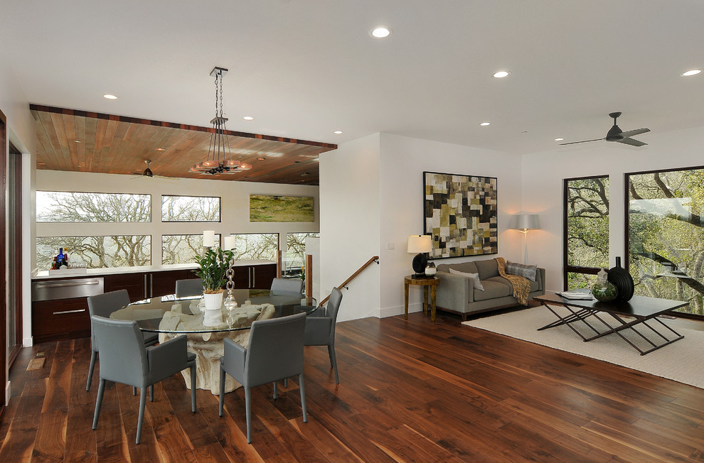 This is an example of a mid-sized modern formal open concept living room in San Francisco with white walls, dark hardwood floors, no fireplace and no tv.