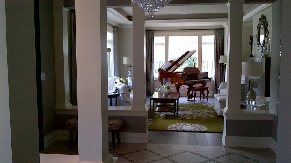 Inspiration for a large transitional open concept medium tone wood floor home design remodel in Toronto with beige walls