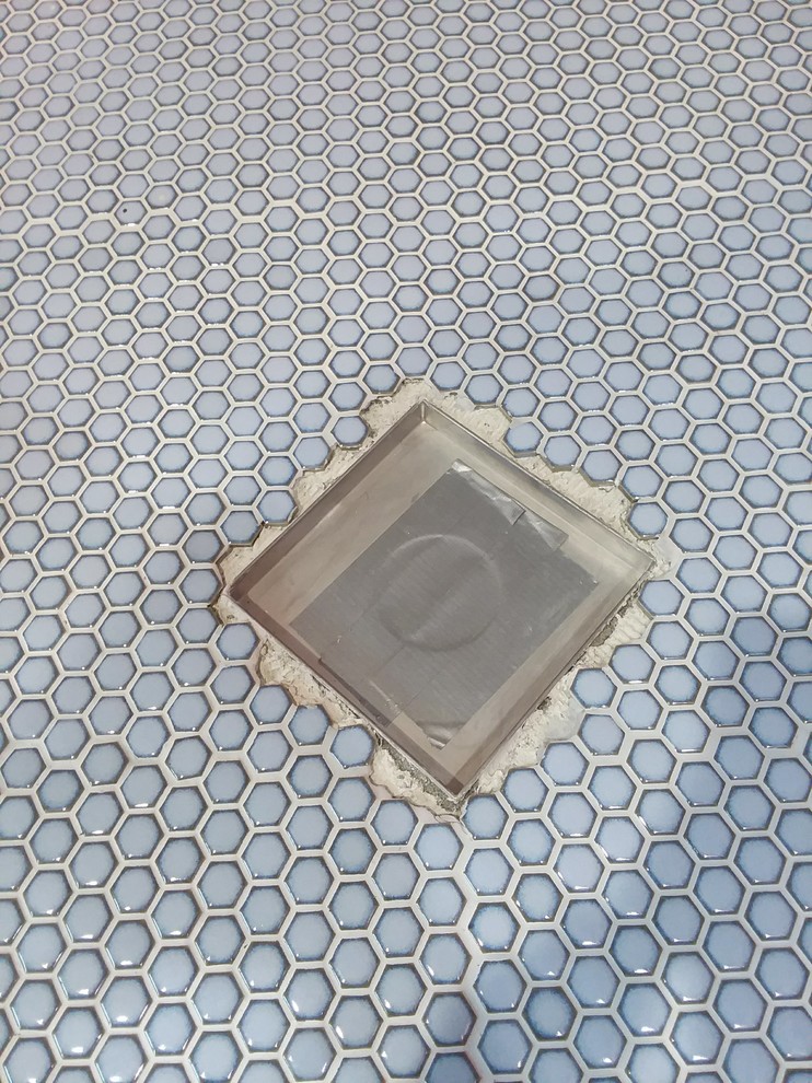 Need help with fitting mosaic tiles around shower drain.