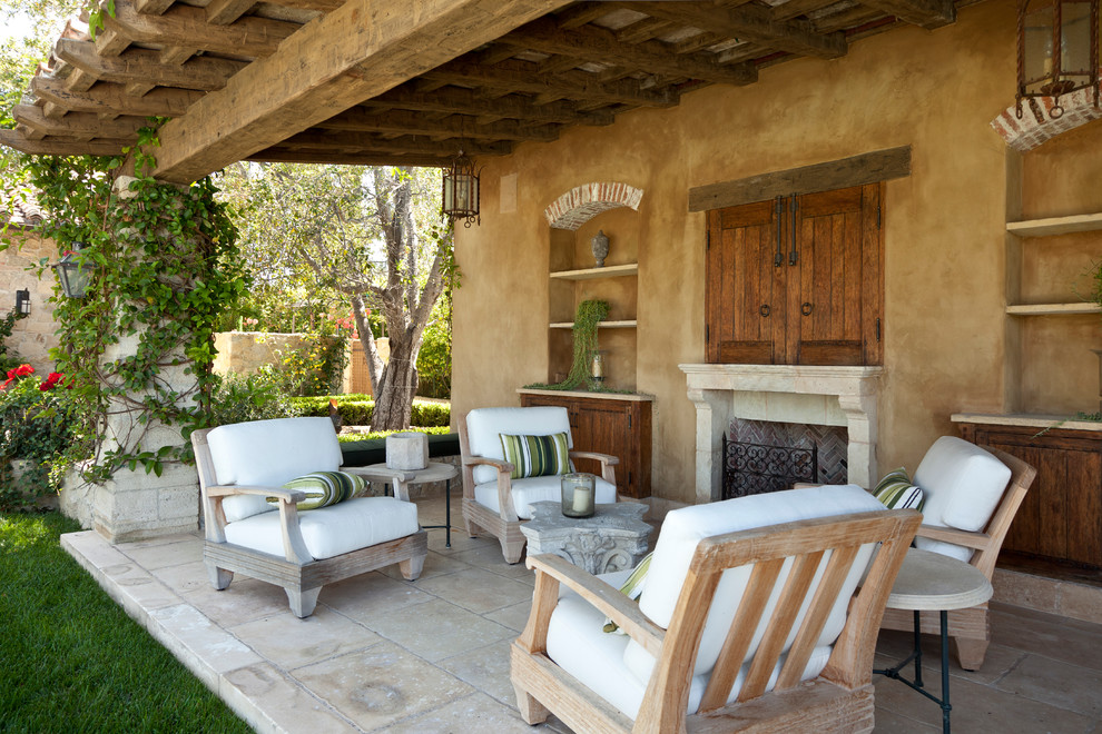 Photo of a mediterranean patio in Los Angeles with a fire feature.