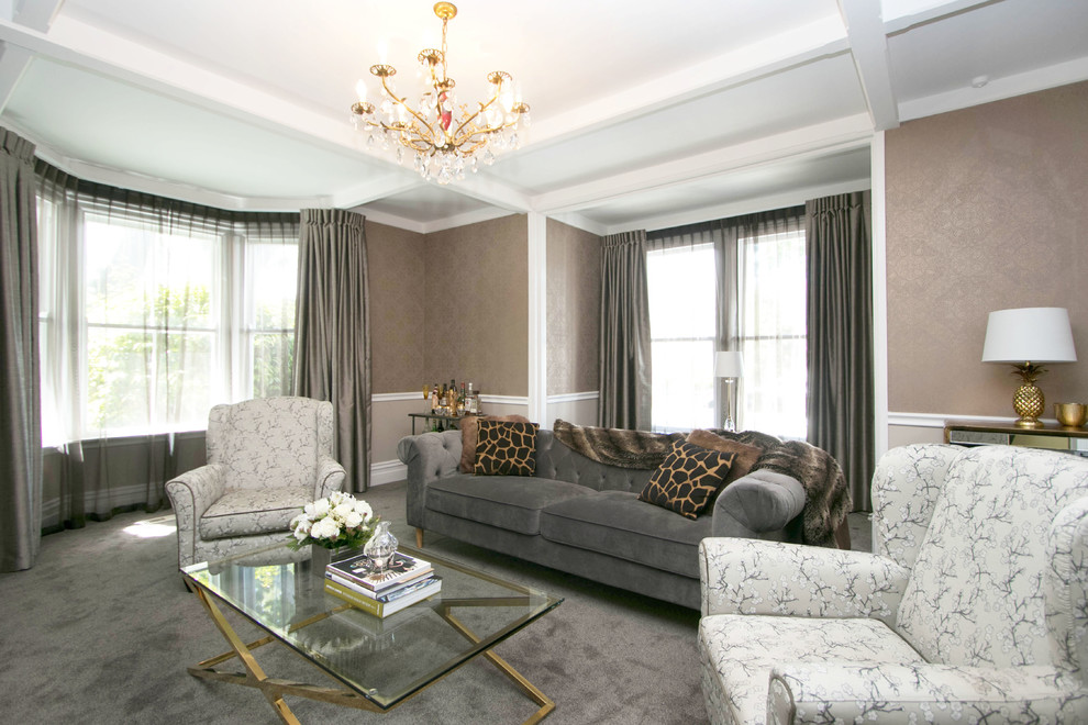 This is an example of a Mid-sized traditional Formal Enclosed living room in Wellington With Beige Walls, Carpet, a Standard Fireplace, a Wood Fireplace Surround, No TV and Grey Floor.