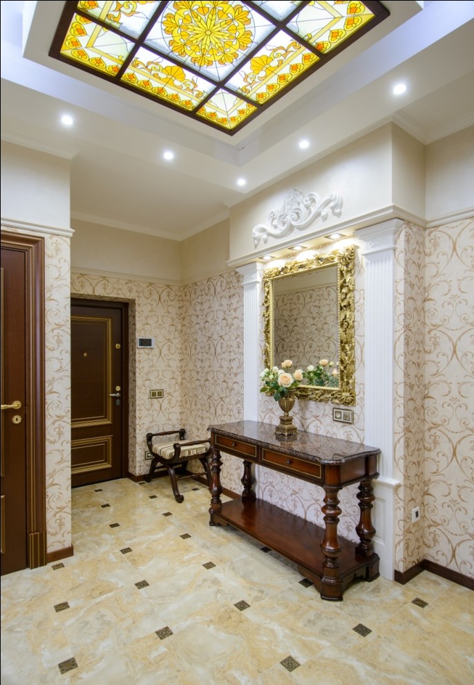 Design ideas for a traditional entry hall in Novosibirsk with beige walls, a single front door and a dark wood front door.