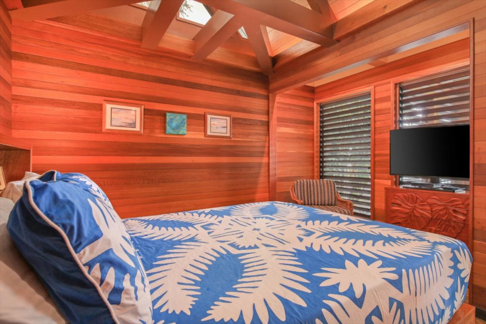 Immagine di una grande camera da letto tropicale