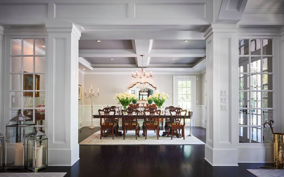 This is an example of an expansive contemporary open plan dining in Philadelphia with white walls, dark hardwood floors and no fireplace.
