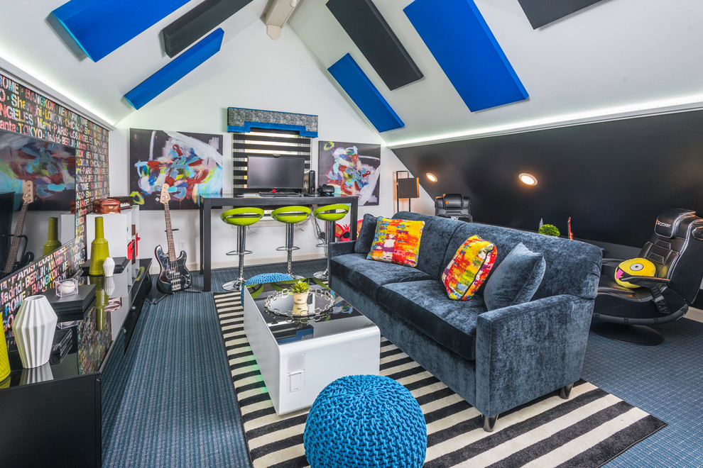 Coming of Age - a teen 'hang space' - This colorful room was created for a young man to have a space to study, play games, music, and entertain his friends. The LED lighting changes color and has pre-programmed patterns. The coffee table is also a refrigerator and charging station.  The computer workstation is also a charging station. the stripes of the banded black shade mimic the stripe of the area rug.