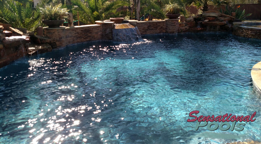 Inspiration for a large mediterranean backyard concrete and custom-shaped natural pool fountain remodel
