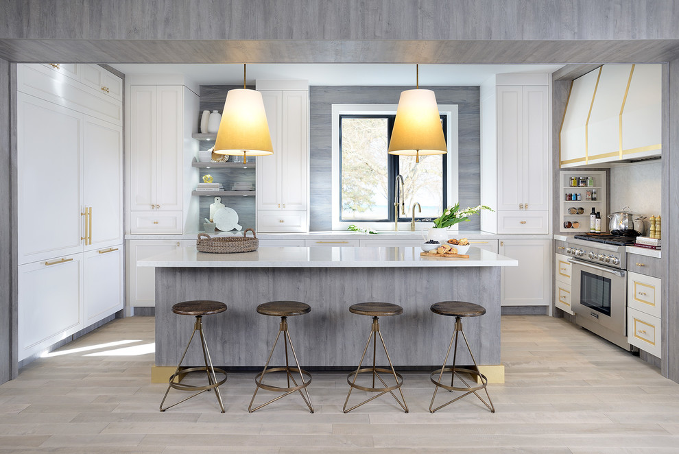 Inspiration for a mid-sized transitional u-shaped open plan kitchen in Toronto with white cabinets, grey splashback, stainless steel appliances, light hardwood floors, with island, an undermount sink, shaker cabinets, solid surface benchtops and grey floor.
