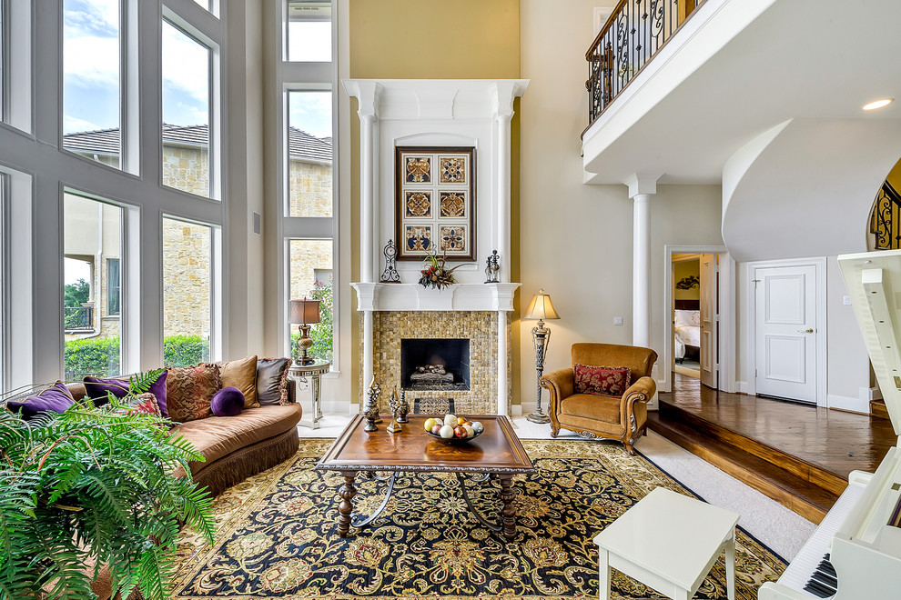 Design ideas for a traditional formal open concept living room in Dallas with yellow walls, carpet, a standard fireplace and a tile fireplace surround.