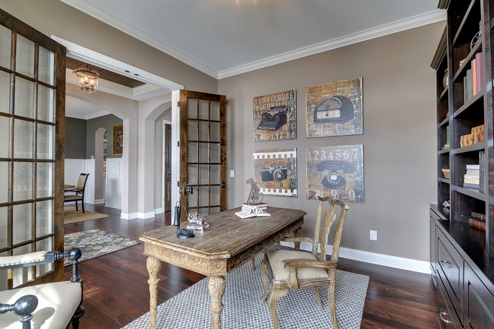 Large elegant freestanding desk dark wood floor study room photo in Minneapolis with gray walls