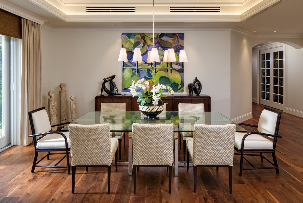 Transitional dark wood floor and brown floor dining room photo with beige walls