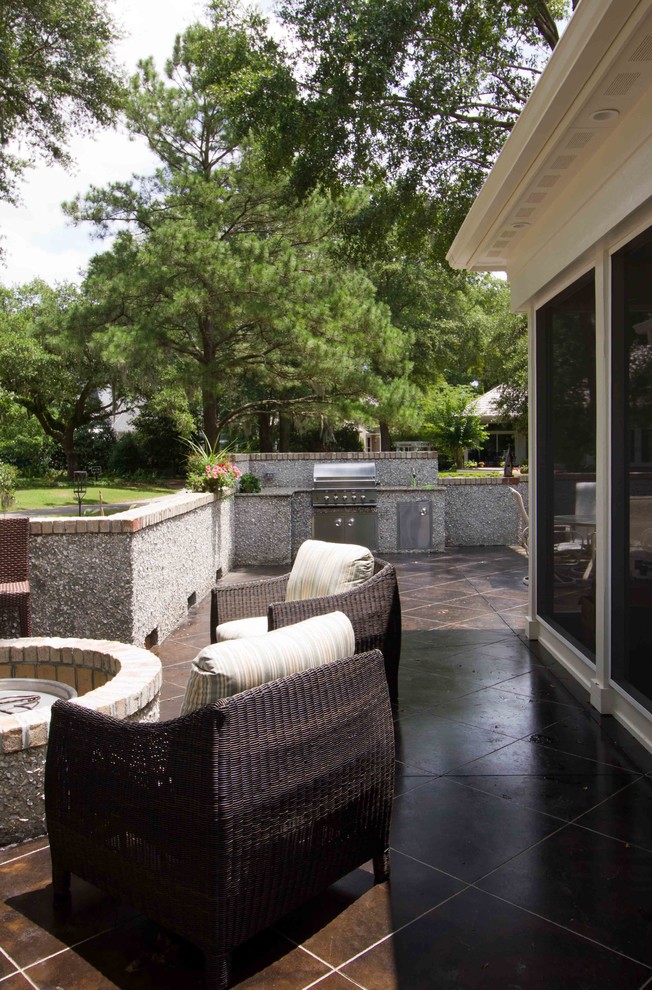 Inspiration for a mid-sized traditional backyard patio in Wilmington with an outdoor kitchen, concrete slab and no cover.