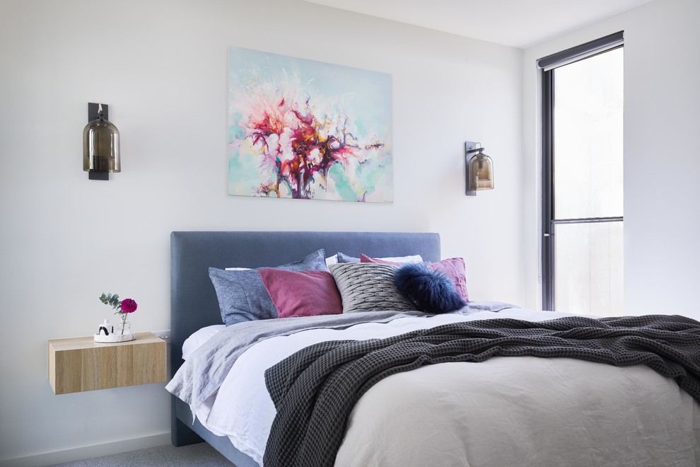 Photo of a contemporary bedroom in Melbourne with white walls, carpet and grey floor.