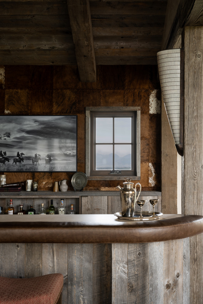 This is an example of a rustic home bar in Other.