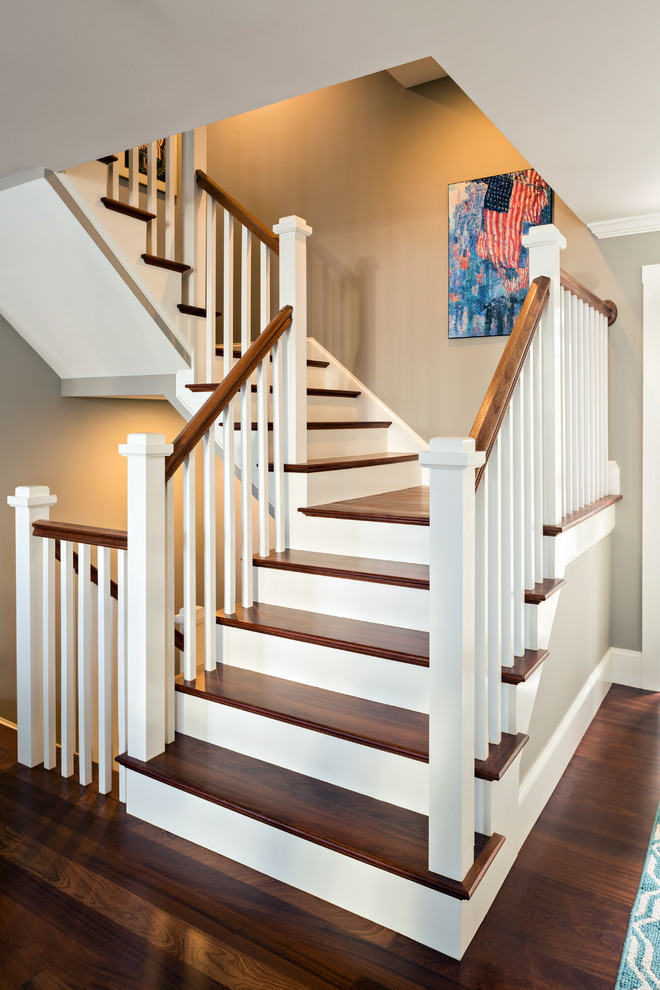 Photo of a mid-sized contemporary wood l-shaped staircase in Boston with wood risers.