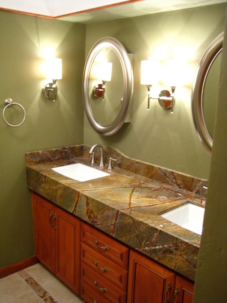 Photo of a contemporary bathroom in Phoenix with raised-panel cabinets, medium wood cabinets, marble benchtops and green walls.