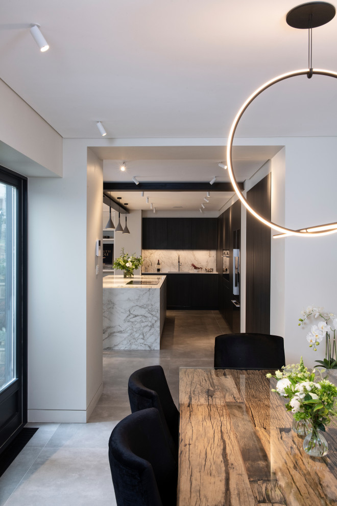 Design ideas for a medium sized contemporary l-shaped open plan kitchen in London with an integrated sink, dark wood cabinets, marble worktops, white splashback, marble splashback, black appliances, concrete flooring, an island, grey floors, white worktops and a wood ceiling.