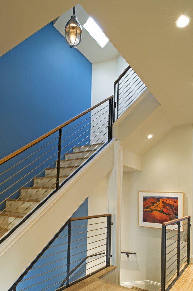 This is an example of a contemporary wood staircase in San Francisco with cable railing.