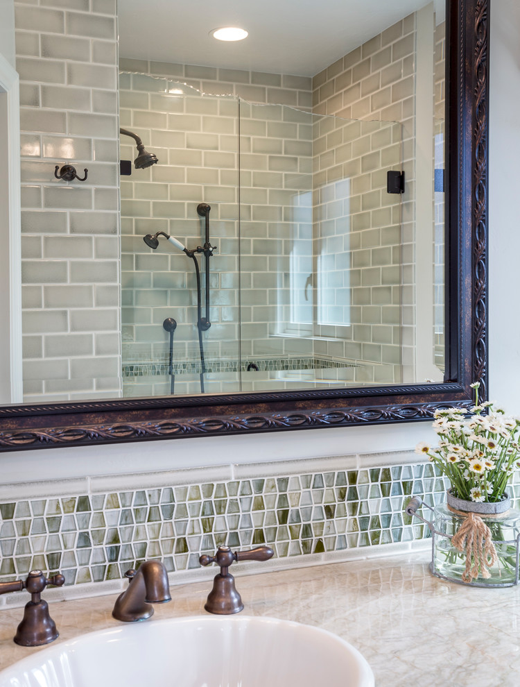 This is an example of a small 3/4 bathroom in Los Angeles with white cabinets, a curbless shower, multi-coloured tile, glass tile and white walls.