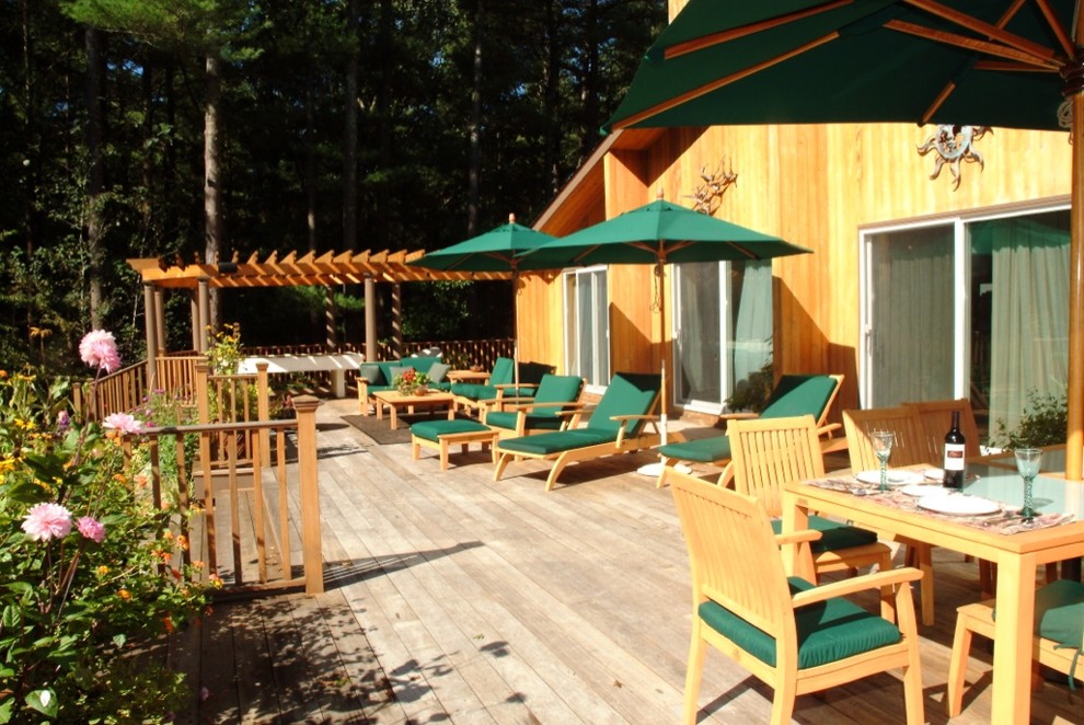 Inspiration for a traditional backyard patio in New York with decking and a gazebo/cabana.