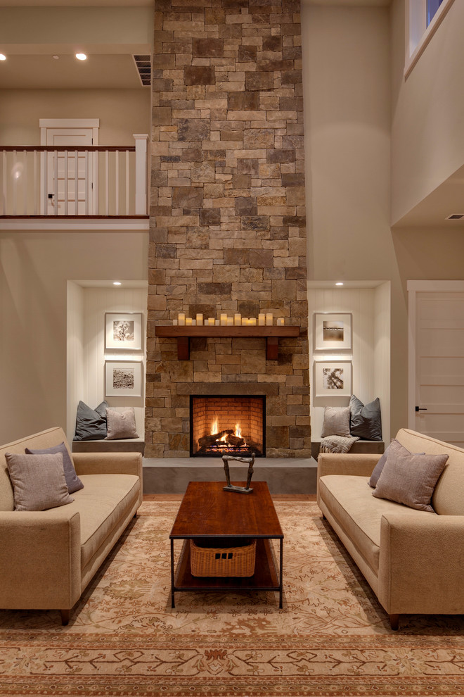 This is an example of an expansive contemporary formal open concept living room in Seattle with grey walls, a stone fireplace surround and no tv.