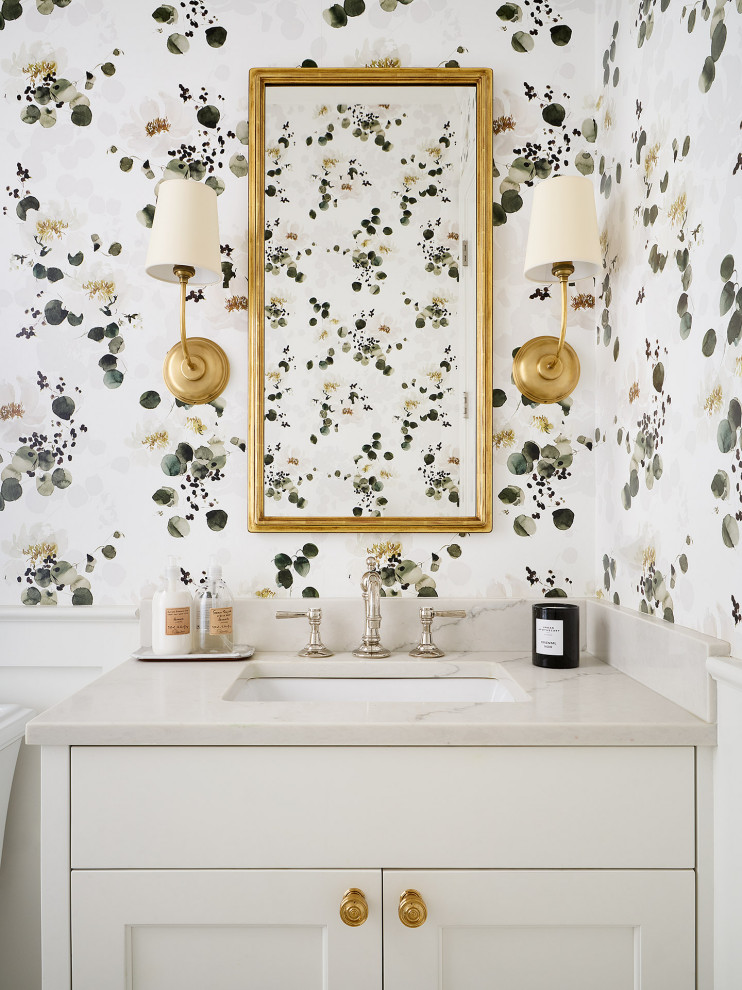 Mid-sized transitional powder room in Chicago with shaker cabinets, white cabinets, a two-piece toilet, white walls, marble floors, an undermount sink, engineered quartz benchtops, white floor, white benchtops, a built-in vanity and wallpaper.