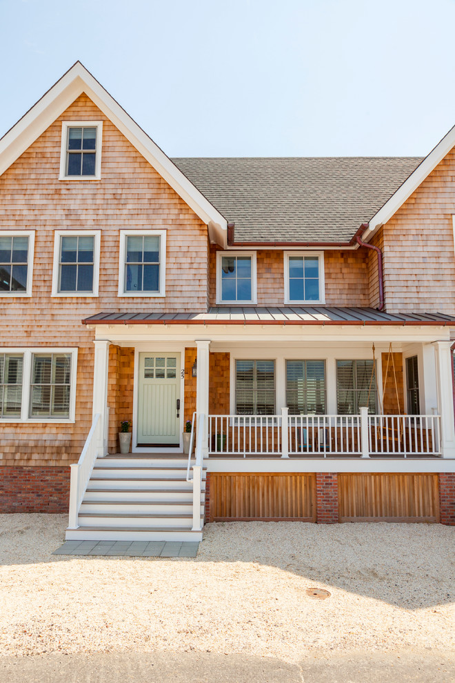 This is an example of a mid-sized beach style exterior in New York.