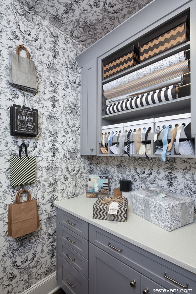 Small transitional dark wood floor closet photo in Raleigh with recessed-panel cabinets and gray cabinets