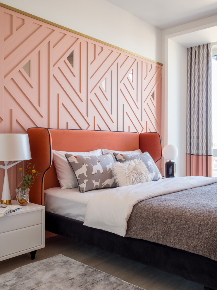 Inspiration for a mid-sized contemporary master bedroom in Other with pink walls, laminate floors and beige floor.