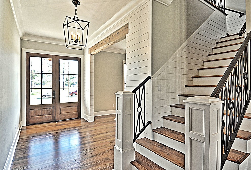 Large transitional dark wood floor and brown floor front door photo in Jackson with gray walls and a dark wood front door