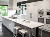 Contemporary Kitchen by Heritage Construction Companies, LLC.