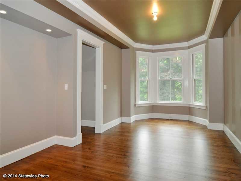 Mid-sized traditional dining room in Providence with grey walls and medium hardwood floors.