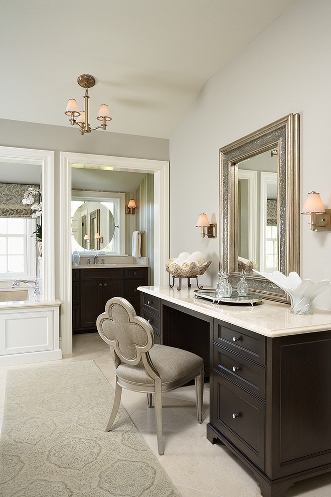 Photo of a traditional bathroom in Minneapolis with recessed-panel cabinets, dark wood cabinets and beige walls.