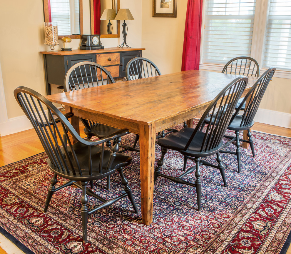 Photo of a mid-sized country separate dining room in Boston with beige walls, light hardwood floors, no fireplace and beige floor.