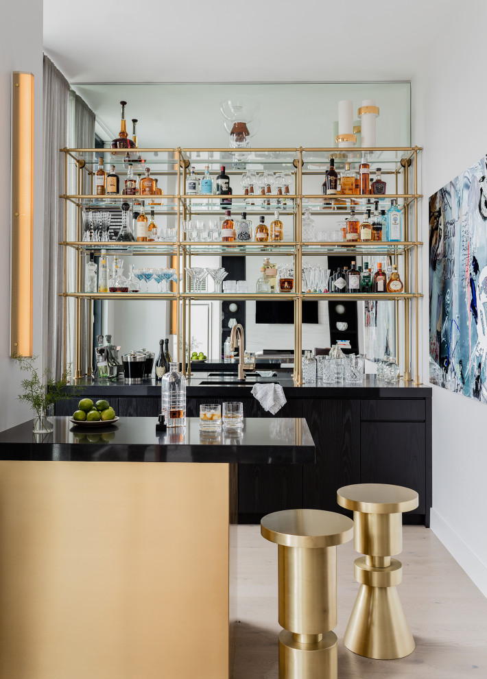 Mid-sized midcentury single-wall wet bar in New York with open cabinets.