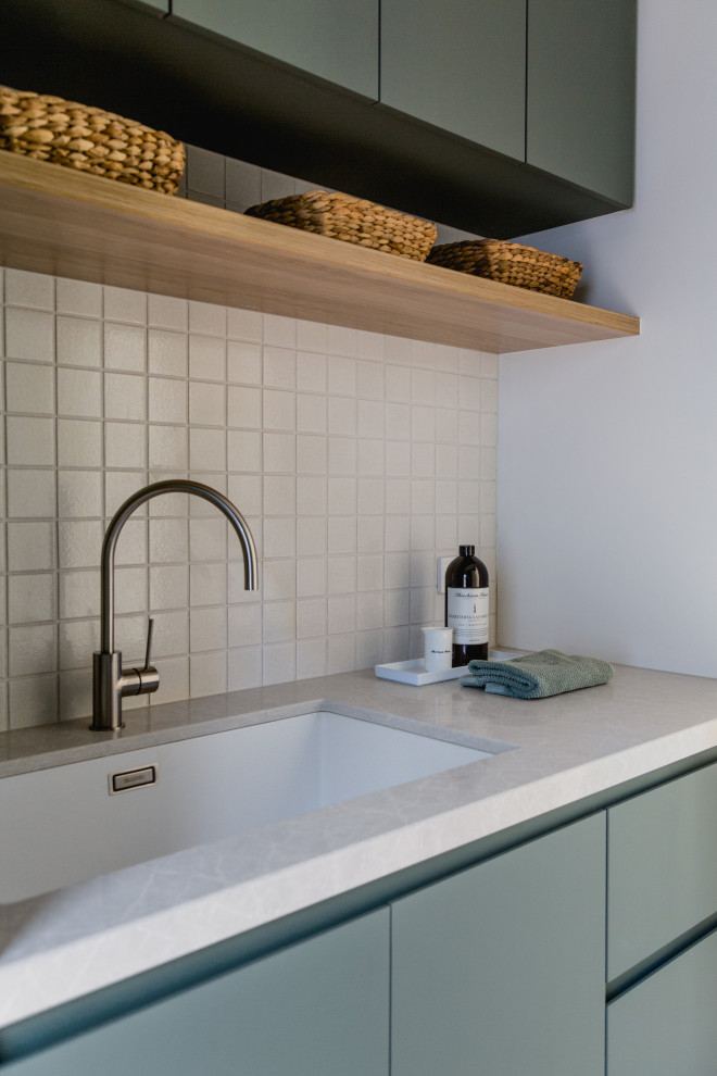 Photo of a beach style utility room in Melbourne.
