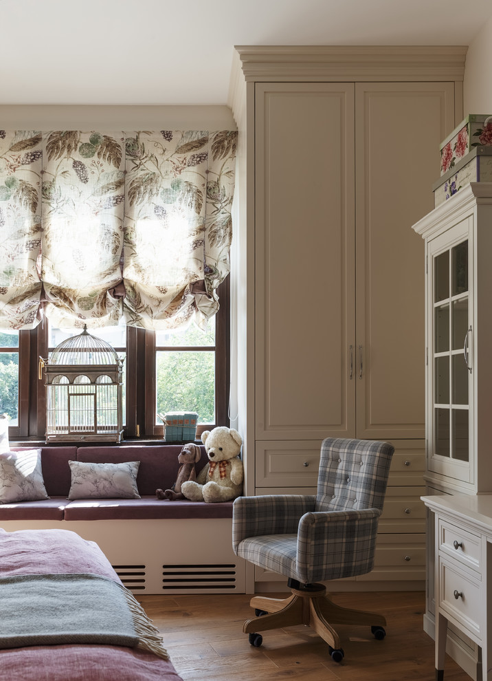This is an example of a transitional kids' room for girls in Moscow with medium hardwood floors and brown floor.