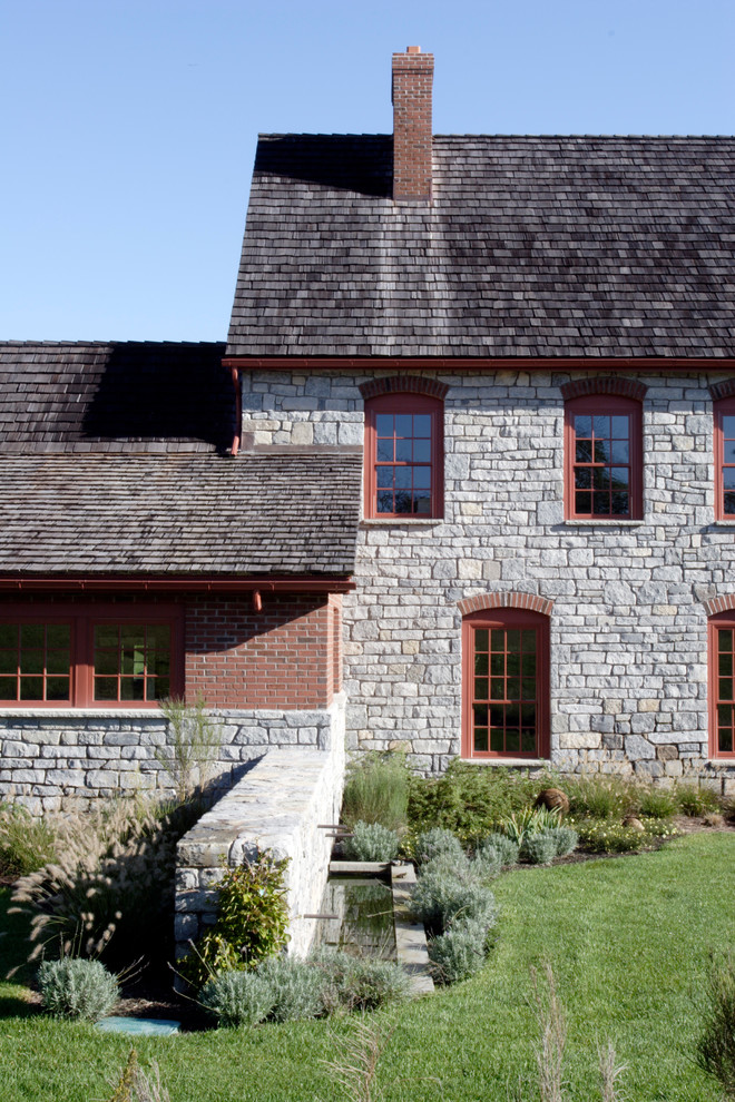 Photo of a traditional exterior in Philadelphia with stone veneer.