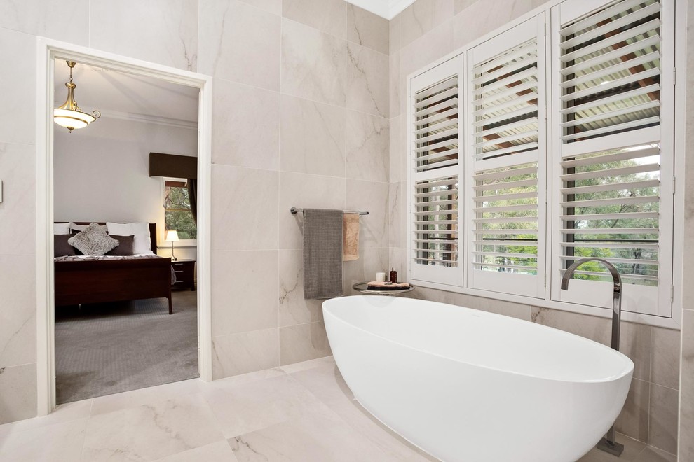 Design ideas for a transitional master bathroom in Perth with a freestanding tub, black and white tile, porcelain tile, porcelain floors and white floor.