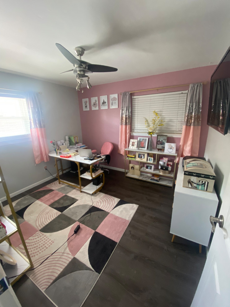 This is an example of a home office in Detroit with pink walls, vinyl floors and grey floor.